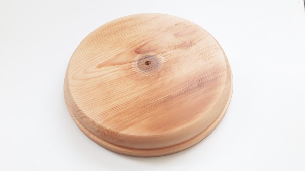 Large round softwood pattress , manufactured from pine